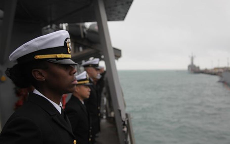 Ensign Crystal Barnes stands on the USS Arleigh Burke as it returns to Rota, Spain, on Dec. 23, 2021. The ship completed a patrol in the U.S. 6th Fleet’s area of operations.