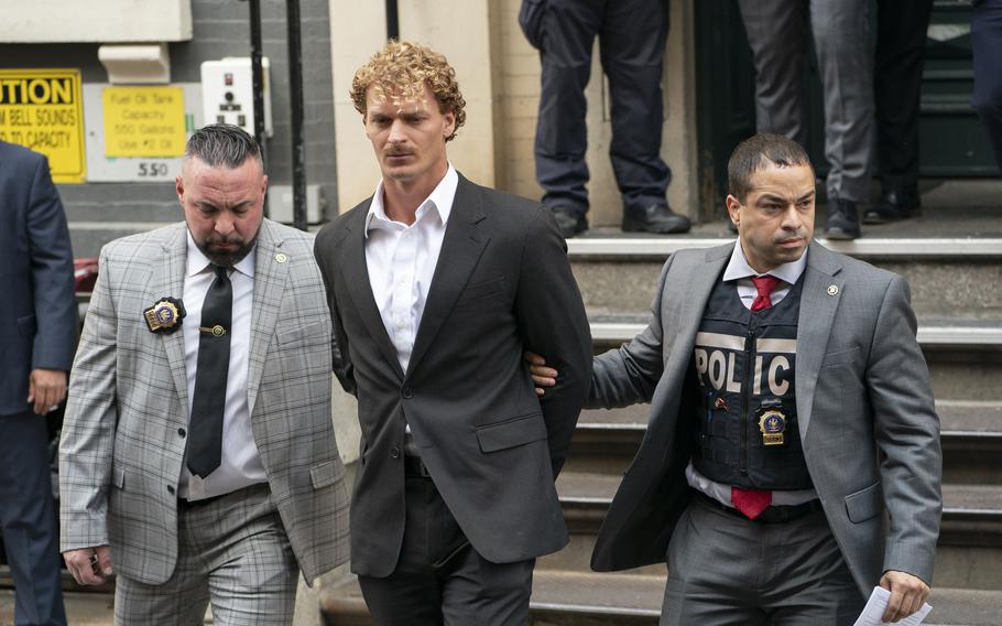 Daniel Penny is escorted from the NYPD 5th Precinct station house in Manhattan on Friday, May 12, 2023.