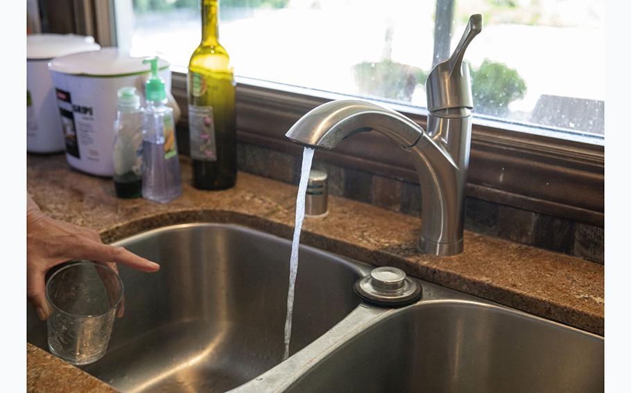 Water runs out of a faucet at a home in Calabasas, Calif., on June 2, 2022.