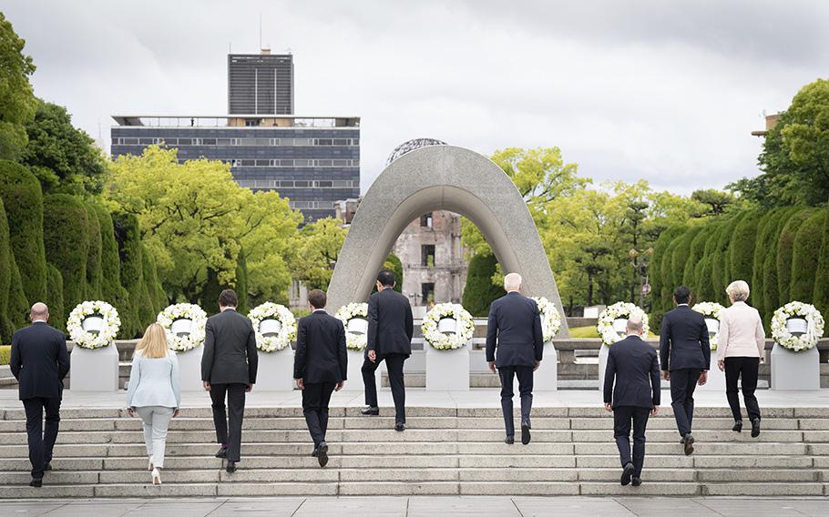 G7 leaders, from left, European Council President Charles Michel, Italian Prime Minister Giorgia Meloni, Canadian Prime Minister Justin Trudeau, French President Emmanuel Macron, Japan’s Prime Minister Fumio Kishida, U.S. President Joe Biden, German Chancellor Olaf Scholz, British Prime Minister Rishi Sunak, and European Commission President Ursula von der Leyen walk together to lay flower wreath,  at the cenotaph for Atomic Bomb Victims, ahead of the G7 Summit in Hiroshima, western  Japan, Friday May 19, 2023. 