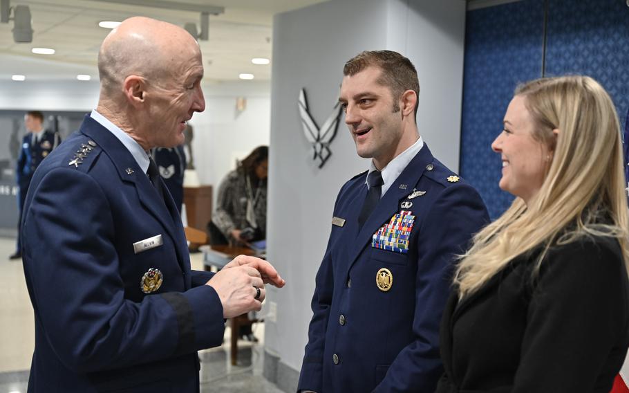 Air Force Chief of Staff Gen. David W. Allvin speaks with Maj. Brady Augustin and Adelaide Augustin after the pilot was awarded the 2022 Koren Kolligian Jr. Trophy at the Pentagon, Arlington, Va., Feb. 7, 2024. The flight safety award recognized Augustin’s feat of airmanship for safely performing a gear-up landing in his F-16 fighter aircraft after losing a wheel during takeoff. 