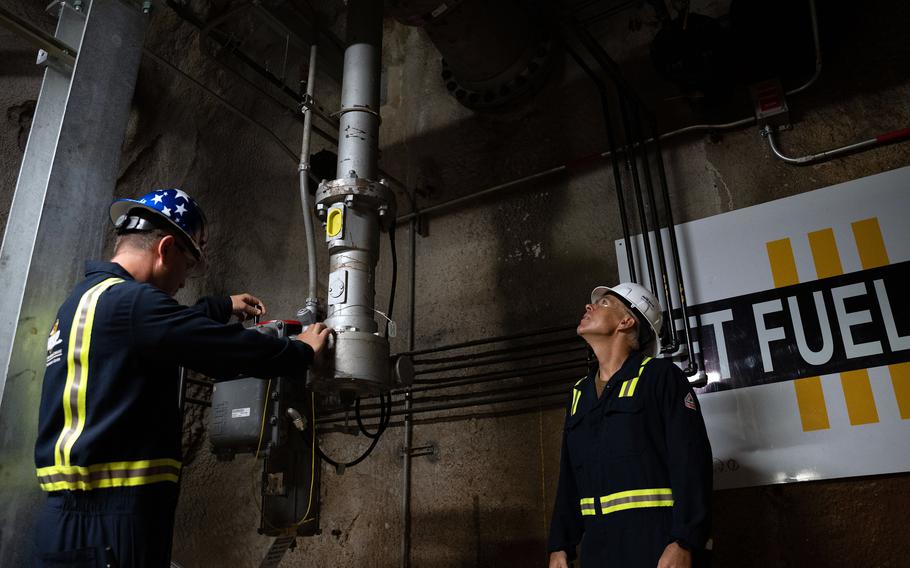 Navy officials inspect fuel gauges and pipes at the Red Hill Bulk Fuel Storage Facility in Halawa, Hawaii, Sept. 5, 2023. 