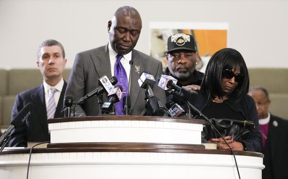 Civil rights attorney Ben Crump speaks at a news conference with the family of Tyre Nichols, who died after being beaten by Memphis police officers, as RowVaughn Wells, mother of Tyre, right, and Tyre's stepfather Rodney Wells, along with attorney Tony Romanucci, left, also stand with Crump, in Memphis, Tenn., Monday, Jan. 23, 2023. (AP Photo/Gerald Herbert)