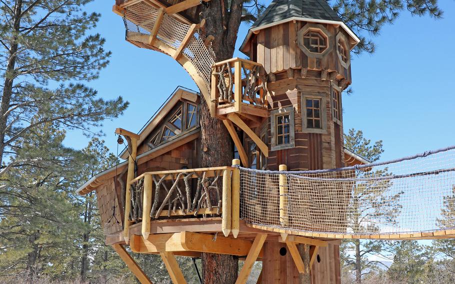 This undated photo provided by Aaron Smith, who owns Treecraft Design-Built in Fort Collins, Colorado, shows a Pagosa Springs treehouse Smith and his firm built. Smith said interest in treehouses has increased in the last few years.