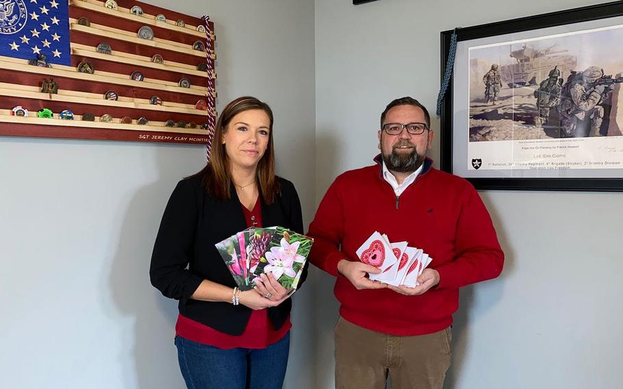 Stow residents Claire and Jeremy McIntire display some of the thousands of valentines sent to troops as part of their annual Operation Valentine's Day. Jeremy is an Iraq war veteran and Purple Heart recipient. Valentines are being collected at Stow (Ohio) City Hall until Jan. 29.