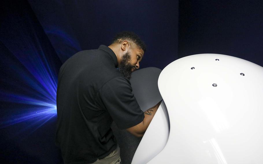 Nap Pod founder and CEO Scott Chester prepares one of the zero-gravity chairs at the Nap Pod in Tampa, Fla.