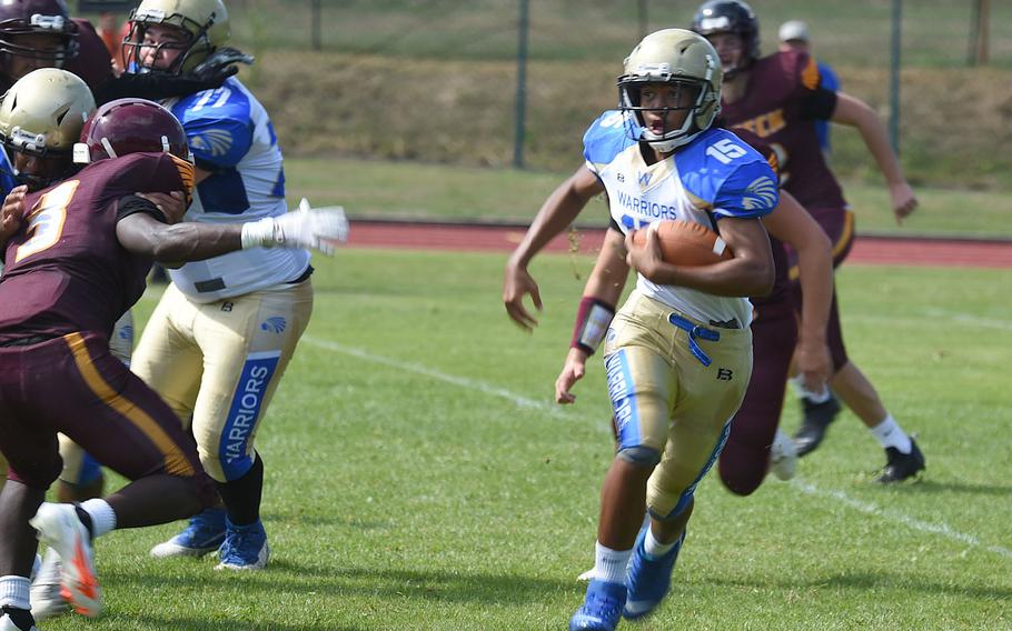 Wiesbaden Warriors’ Adam Gomez rushes through a sea of defenders before meeting the full force of the Vilseck defense. 