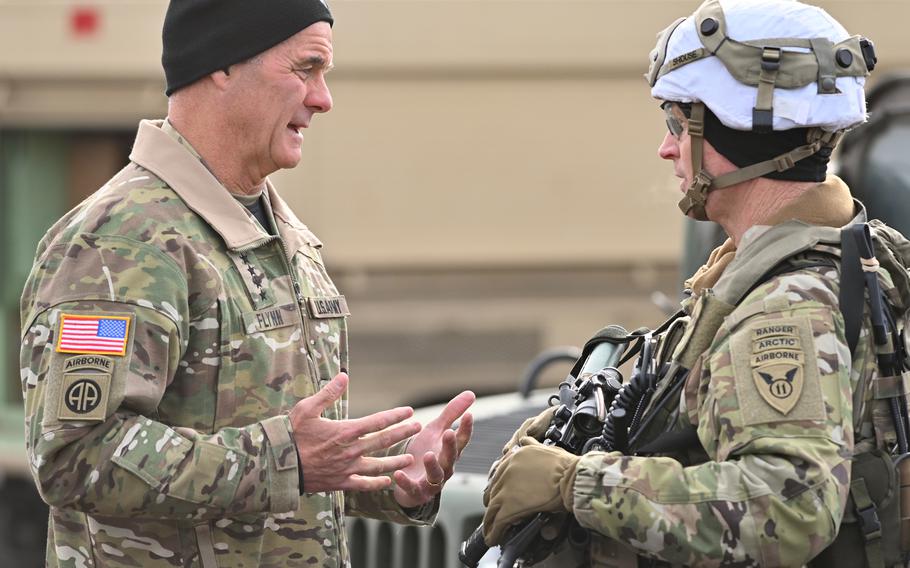 Gen. Charles A. Flynn, U.S. Army Pacific commanding general, discusses training with Col. Michael “Jody” Shouse, commander of the 2nd Infantry Brigade Combat Team (Airborne), 11th Airborne Division, outside the 2/11th tactical operations center in the Yukon Training Area, Alaska, March 30, 2023. Flynn was in the state to observe exercise Joint Pacific Multinational Readiness Center-Alaska 23-02.