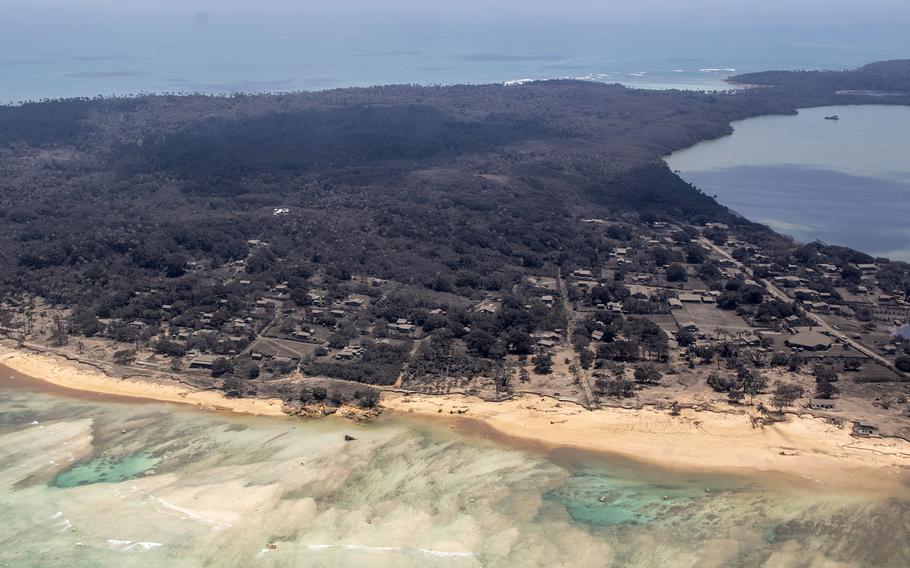 Volcanic ash covers roof tops and vegetation in an area of Tonga, on Monday, Jan. 17, 2022.