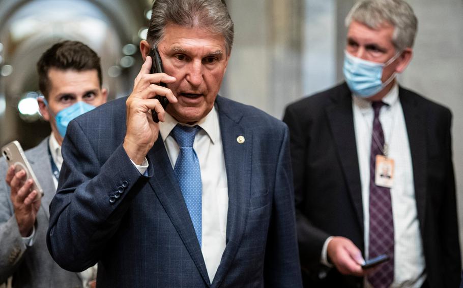 Sen. Joe Manchin, D-W.Va., departs after a vote on Capitol Hill in Washington on Oct. 7.