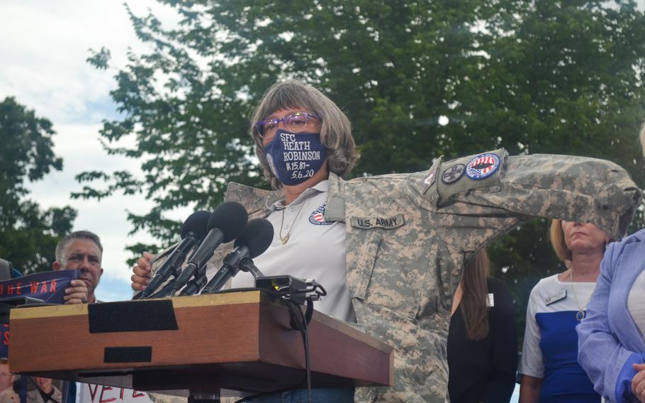 Susan Zeier wears the Army jacket of Heath Robinson, her son-in-law, at a rally on Capitol Hill in Washington, D.C., on Thursday, July 28, 2022. Lawmakers and veterans advocates gathered to voice their anger over the Senate blocking the Sergeant First Class Heath Robinson Honoring Our Promise to Address Comprehensive Toxics Act of 2022, or PACT Act. 