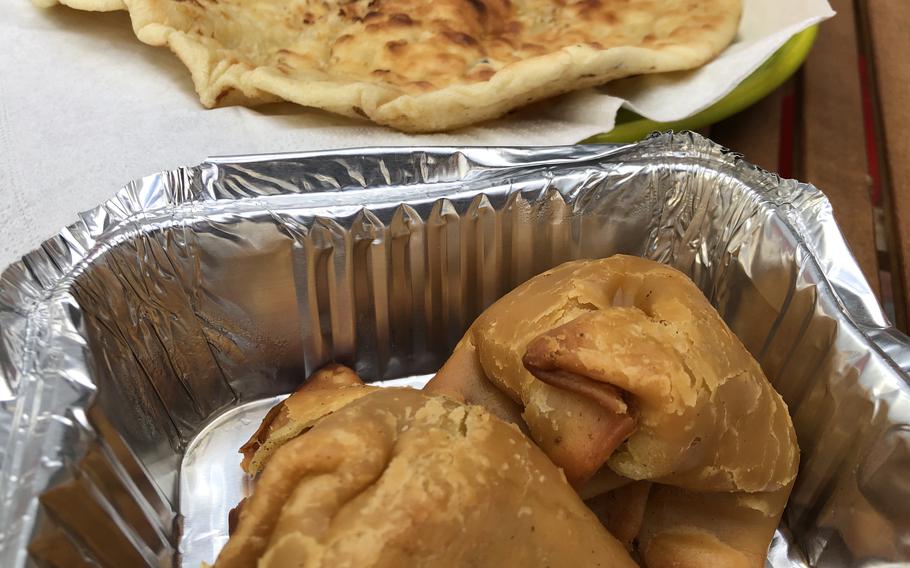 Samosas and garlic naan from Raj Mahal Indian restaurant in Kaiserslautern, Germany. This is the takeout version.