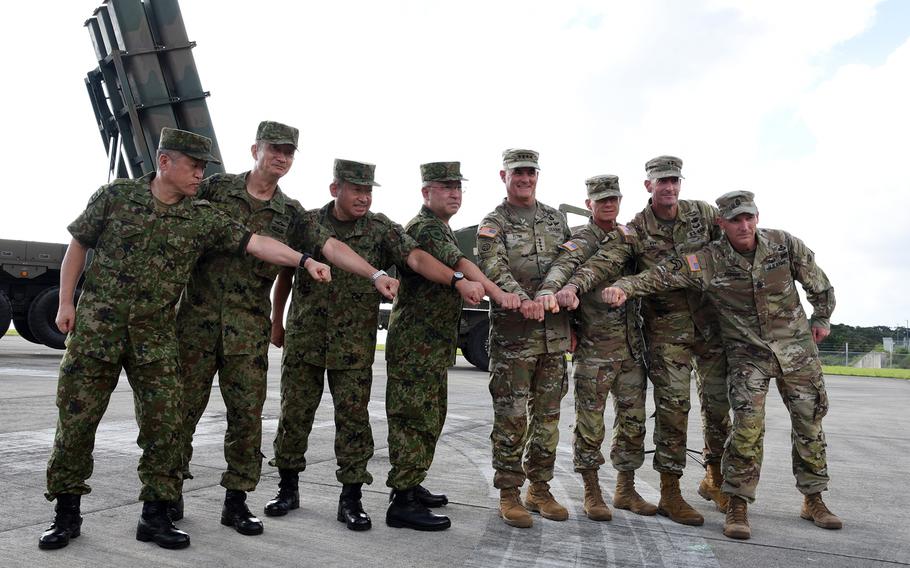 Leaders of the U.S. Army and Japan Self-Defense Force pose following a press conference in Amami Oshima, Japan, Thursday, Sept. 8, 2022. 