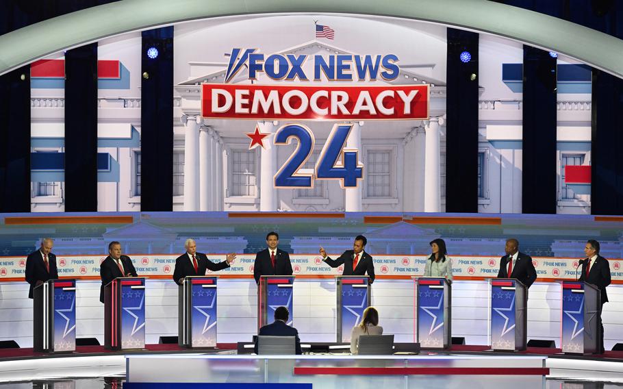 Former vice president Mike Pence (third from left) and businessman Vivek Ramaswamy (fourth from right) speak during the first Republican presidential debate hosted by Fox News in Milwaukee. Few of the candidates were willing to attack former president Donald Trump, who did not attend, by name during the debate. 