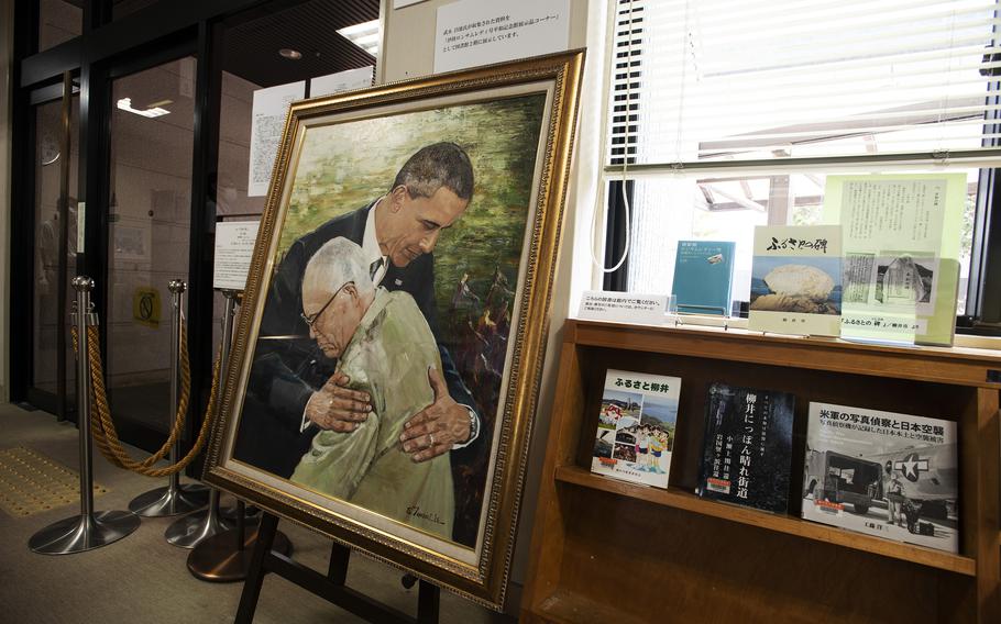 President Barack Obama’s impromptu embrace of an atomic bombing survivor in May 2016 inspired a painting that was unveiled near Hiroshima ahead of the event’s 77th anniversary. 