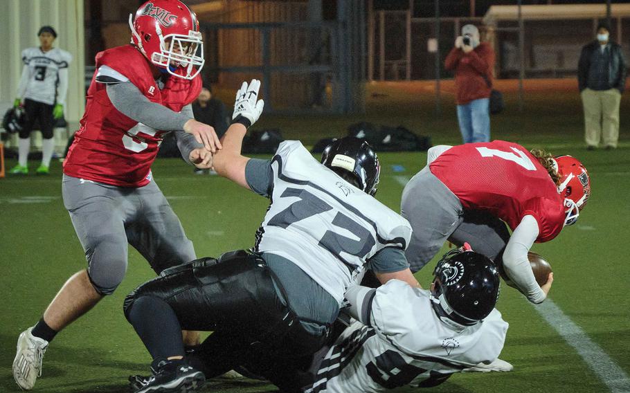Kinnick's Zeke DeLaughter gets sacked for a 12-yard loss by Zama's Troy Sessions.