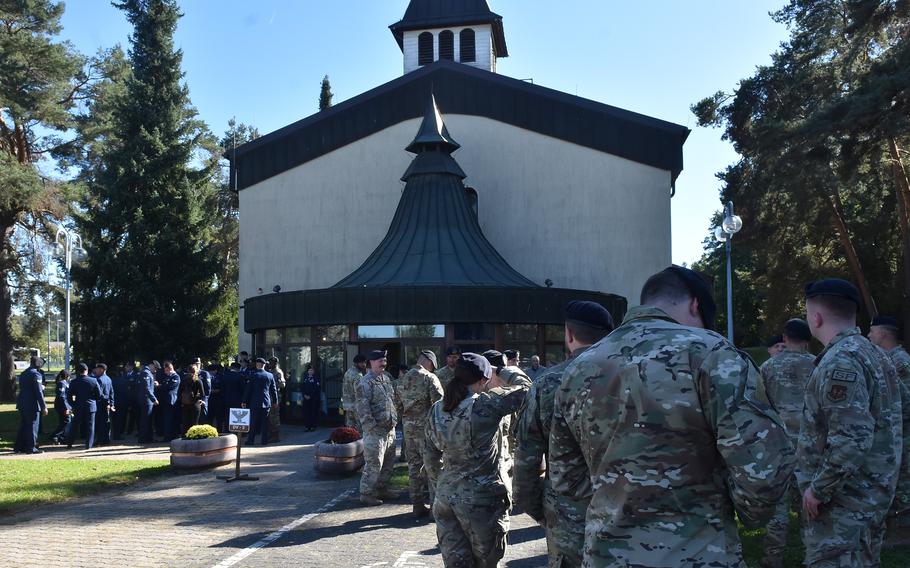 Air Force and German security forces personnel gather outside the Vogelweh chapel in Kaiserslautern, Germany, on Sept. 26, 2023, for a memorial service for Senior Airman Christopher Rocha. The 569th U.S. Forces Police Squadron member died earlier this month from injuries in an August car crash near Ramstein Air Base.