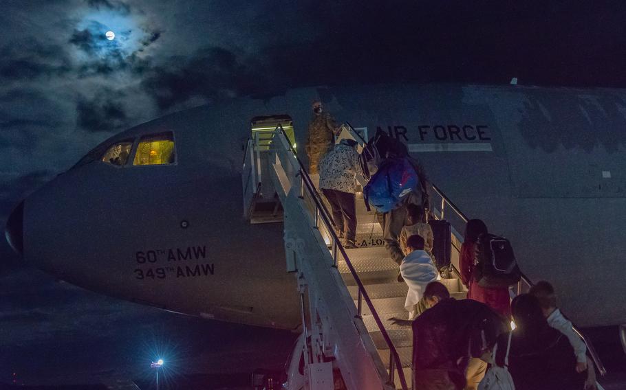 U.S. citizens and their families process through the passenger terminal at Ramstein Air Base, Germany, to board a flight on their way to the United States, Aug. 23, 2021. 