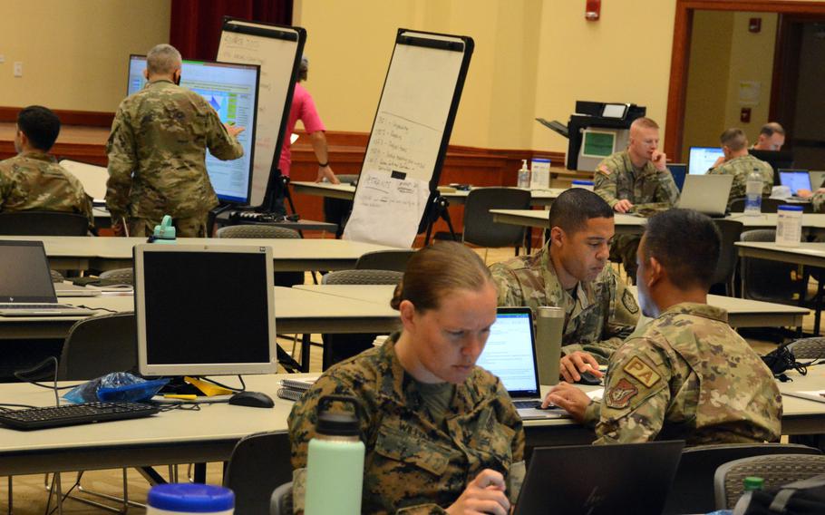 Personnel with Joint Task Force-Red Hill work on plans to defuel the Red Hill fuel storage facility from their headquarters on Ford Island, Hawaii, Monday, Oct. 3, 2022.