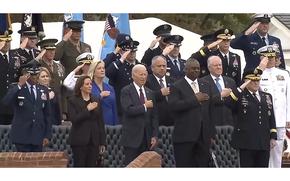 A video screen grab shows the change of command ceremony for retiring Chairman of the Joint Chiefs of Staff Army Gen. Mark Milley, front right, and incoming JCS Chairman Air Force Gen. CQ Brown, Jr., front left. Between them are from left: Vice President Kamala Harris, President Joe Biden and Defense Secretary Lloyd Austin. The ceremony took place at Joint Base Myer-Henderson, Va., on Friday, Sept. 29, 2023.