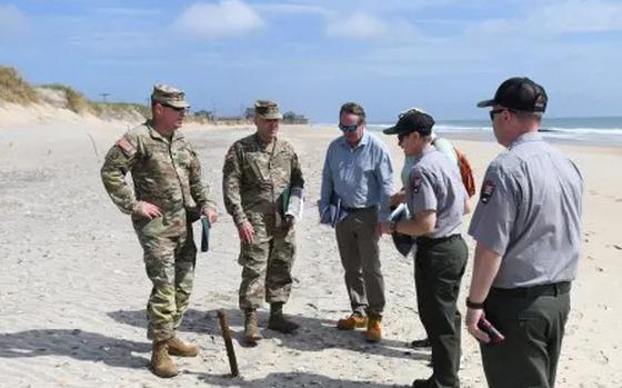 The U.S. Army Corps of Engineers’ leadership team meets with National Park Service staff on the beach near Buxton Beach Access on May 1, 2024.