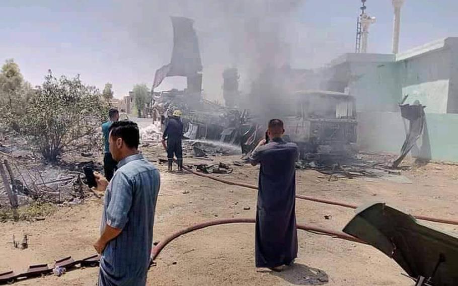 Iraqis inspect the damage after al Asad Air Base was hit in a rocket attack, July 7, 2021. It was the second rocket attack targeting the base this week and follows two attempted drone attacks on U.S compounds elsewhere in Iraq.