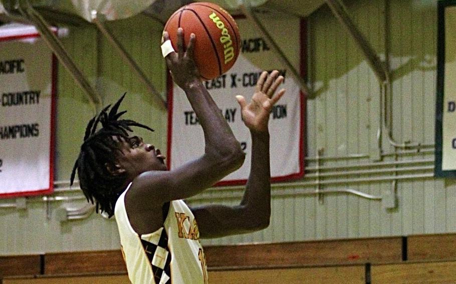 Kadena's DeShaun Nixon skies for a shot against Kubasaki during Friday's DODEA-Okinawa boys basketball game. The Panthers won 58-29, improving to 3-0 against the Dragons this season.