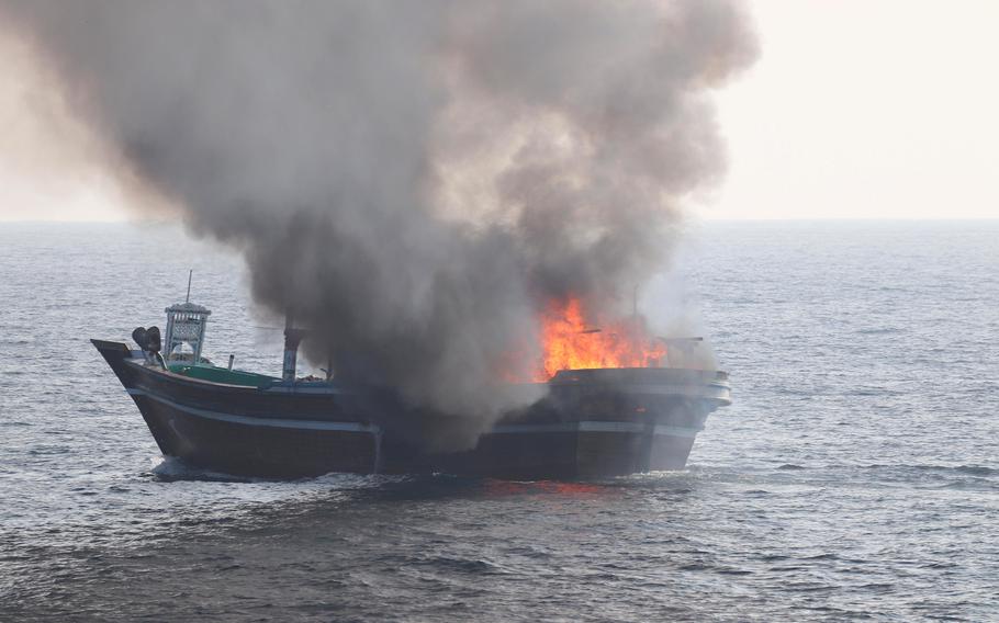A civilian vessel burns in the Gulf of Oman on Oct. 29, 2022. The vessel was smuggling drugs and was set on fire by the crew as U.S. forces approached, the Navy said.