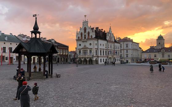 The sun sets behind the Ratusz, or town hall, on Rzeszow, Polands Rynek, or market square. The town hall was built in the late 16th century.
