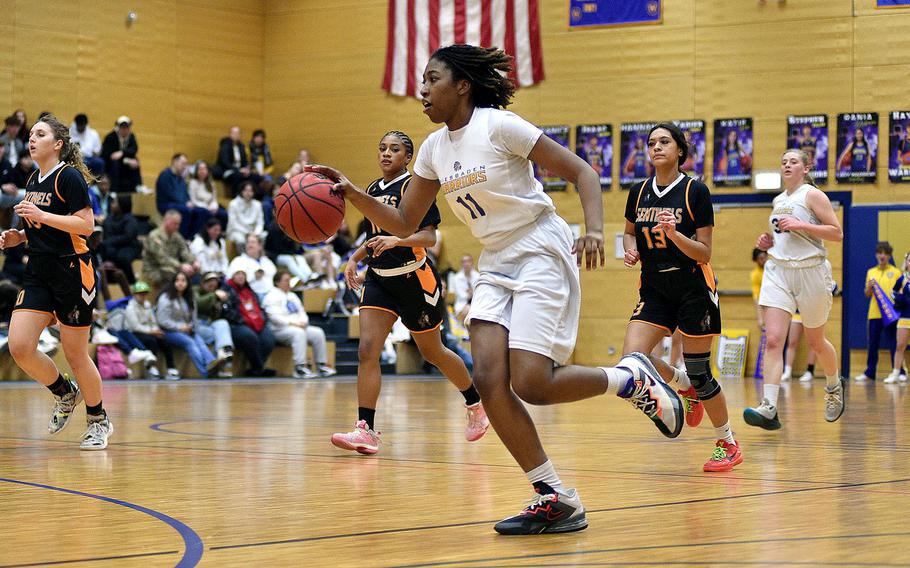 Wiesbaden's Kariyah Housey dribbles on the fast break during a game against Spangdahlem on Jan. 19, 2024, at Wiesbaden High School in Wiesbaden, Germany.