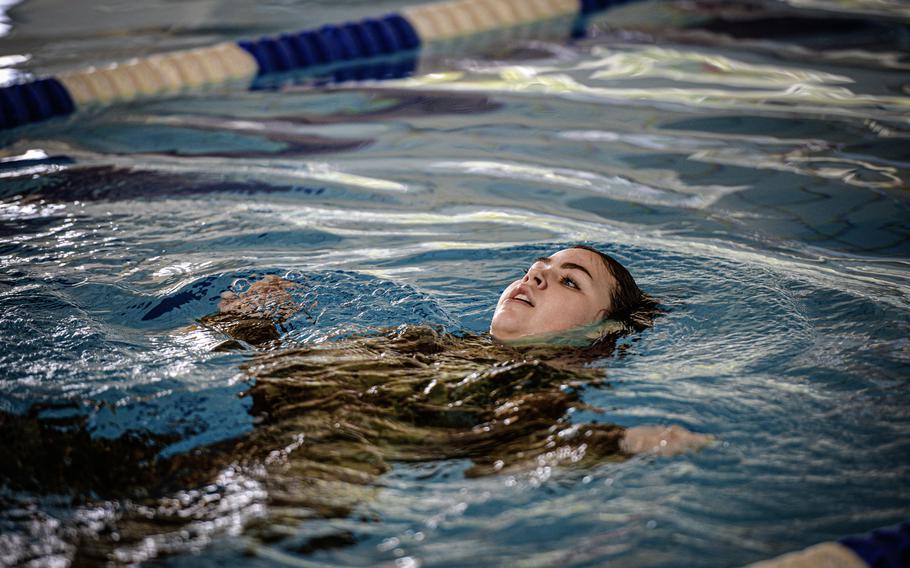 Airman Arabella Ellis, a postal clerk with the 786th Force Support Squadron, uses the backstroke during the swim portion of the German Armed Forces Badge for Military Proficiency at Ramstein Air Base, Germany, April 22, 2024. Service members from all services, units and career fields were eligible to attempt to meet the German military's requirements to earn the proficiency badge.