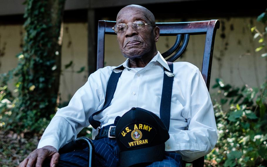 Eugene Bishop sits for a portrait outside his home on his 100th birthday on July 22 in Temple Hills, Md. 