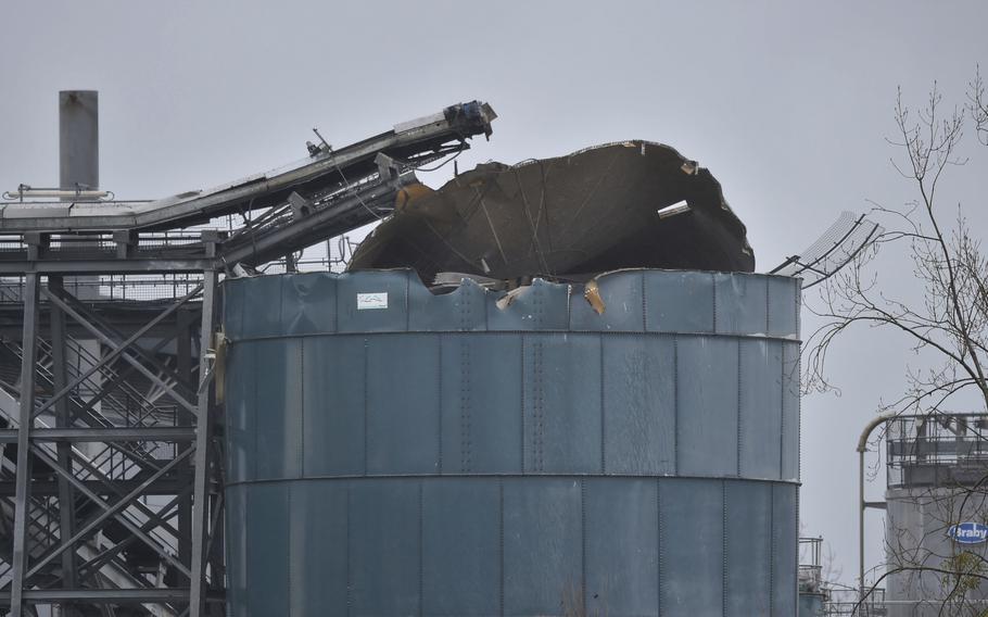 The warehouse where emergency services attend to a large explosion in Bristol, England, Thursday Dec. 3, 2020. A local British emergency services department says there have been “multiple casualties” following a large explosion at a warehouse near the southwest England city of Bristol. (Ben Birchall/PA via AP)