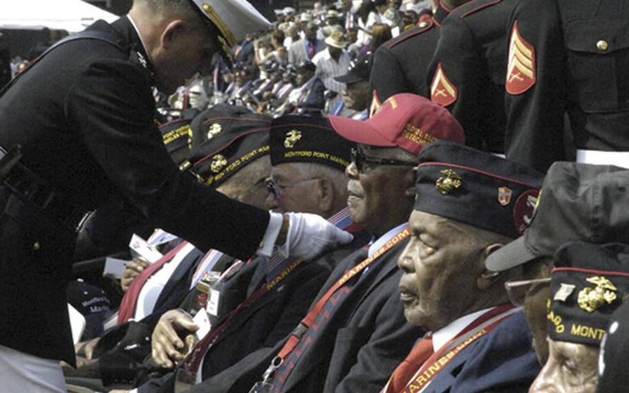 Hundreds of Montford Point Marines are presented with a bronze replica of the Congressional Gold Medal during a ceremony at the Marine Barracks in Washington, D.C., on June 28, 2012. Atlanta resident Lee Raymond Shelton was one of the latest Montford Marines to get his recognition on Wednesday, Feb. 8, 2023.