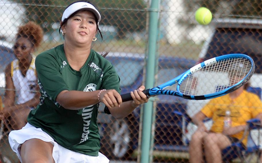 Kubasaki's Noemi Ung hits a backhand against Kadena's Mary Tracy during Thursday's Okinawa tennis matches. Ung won 8-6.