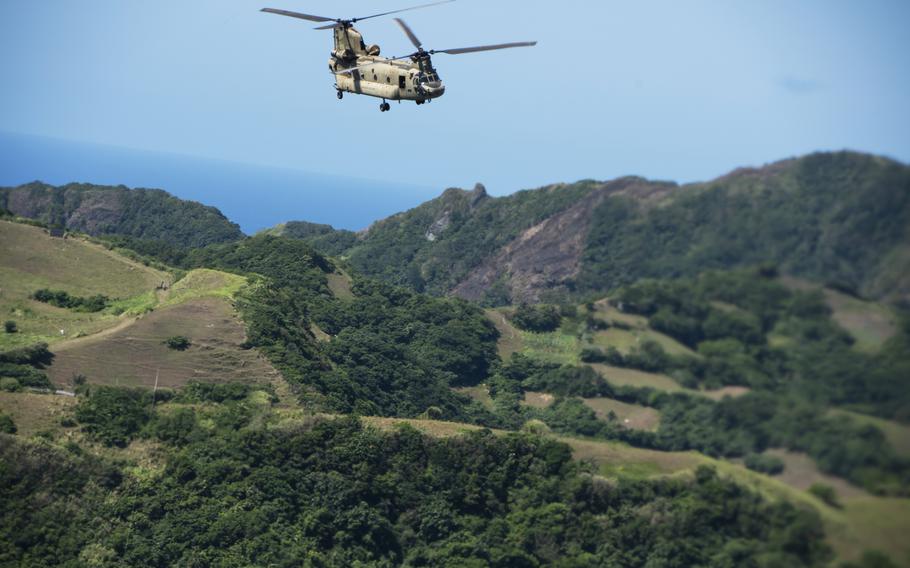 A CH-47F Chinook helicopter flies 25th Infantry Division soldiers over Batan Island, Philippines, during the Balikatan exercise, May 5, 2024.
