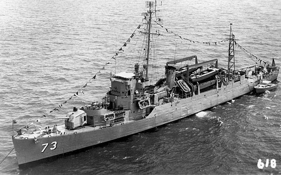 The high-speed transport USS Bassett (APD-73), which joined in the August 1945 rescue of survivors from the heavy cruiser USS Indianapolis after it sunk from a torpedo attack, is seen at anchor in the 1950s. The dog tags of a sailor who served on the Bassett were recently discovered tangled up in the roots of an orchid plant that was being repotted in a small Californian community. The tags were returned to the WWII veteran’s son.