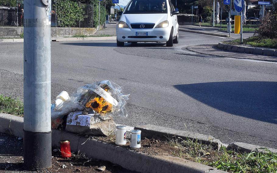 A car passes through a roundabout in Sant’ Antonio, Italy, on Aug. 22, 2022, where an Italian teenager was killed a day earlier in an apparent crash involving a U.S. airman. Italian media reports citing prosecutors said the airman tested well over the blood alcohol limit for driving.