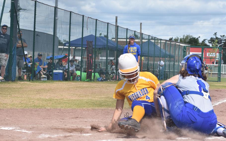 Ramstein catcher Isabella Naglack tags out Wiesbaden's Elise Luden at home on Saturday, May 21, 2022, at the DODEA-Europe Division I softball championships at Kaiserslatuern, Germany.