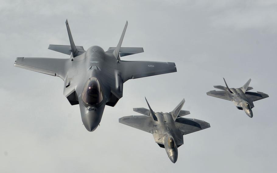 A Norwegian air force F-35, left, flies in formation with two U.S. Air Force F-22 Raptors over Norway in 2018. The U.S. State Department cleared the way for the sale of F-35s to Germany, in what would be a major upgrade to that country's air force.