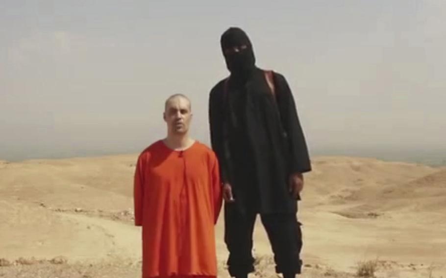 A screen grab from a video released by Islamic State militants on Aug. 19, 2014, purports to show journalist James Foley before he was killed. The family of slain American journalist Steven Sotloff filed a federal lawsuit Friday, May 13, 2022, accusing prominent Qatari institutions of wiring $800,000 to an Islamic State “judge” who ordered Sotloff’s and Foley’s murders.