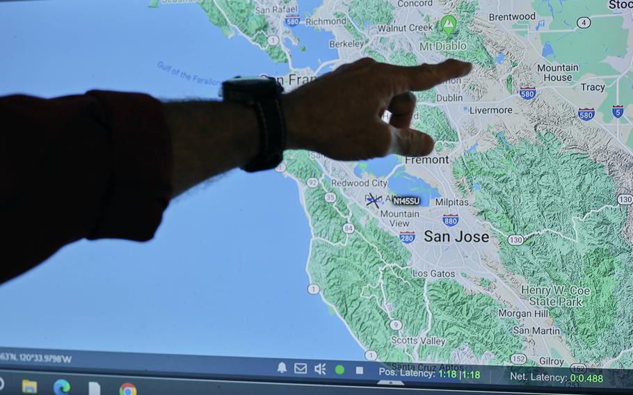 Michael Baulch, program manager of Stanford Life Flight, points to areas of helicopter service coverage across California. 