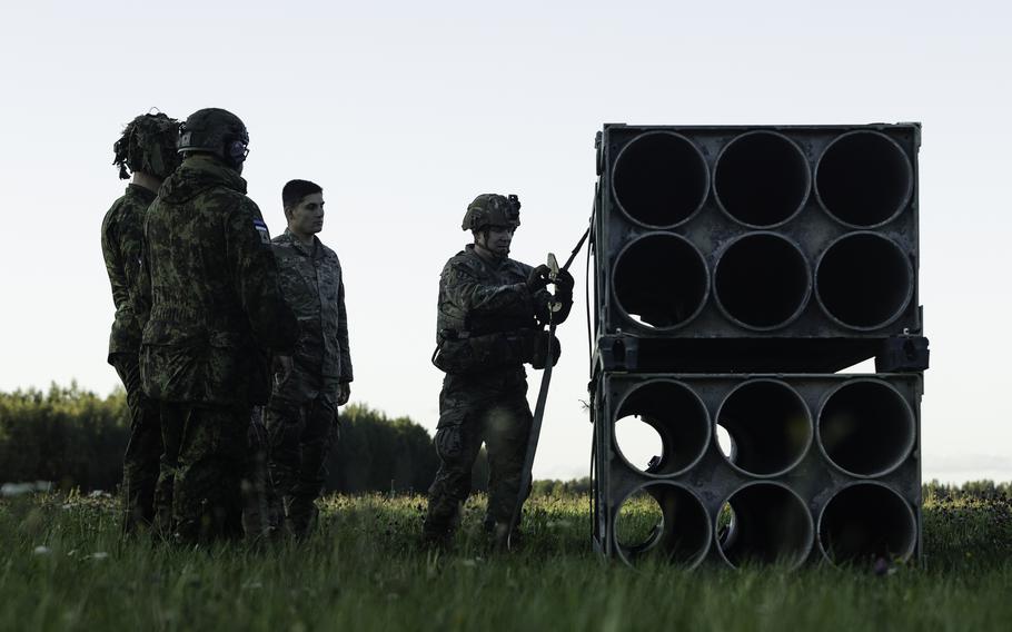 U.S. Army 1st Sgt. Bret Lowery, right, senior enlisted leader with 3rd Battalion, 27th Field Artillery Regiment, supporting 4th Infantry Division, instructs Estonian Defense Forces soldiers how to properly secure High-Mobility Rocket Artillery System (HIMARS) training-ammunition pods during a sling-load training exercise in Voru, Estonia, Sept. 6, 2023. The Pentagon on Thursday, Sept. 7, announced a new security aid package for Ukraine worth $600 million that includes more ammunition for HIMARS.