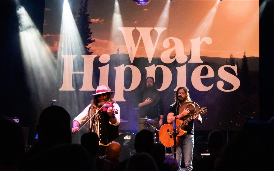 Army veteran Donnie Reis plays “The Star-Spangled Banner” on his violin alongside his War Hippies counterpart Scooter Brown during a concert March 9, 2023, at MadLife Stage & Studios in Woodstock, Ga., just north of Atlanta.