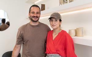 A couple poses for a photo.
