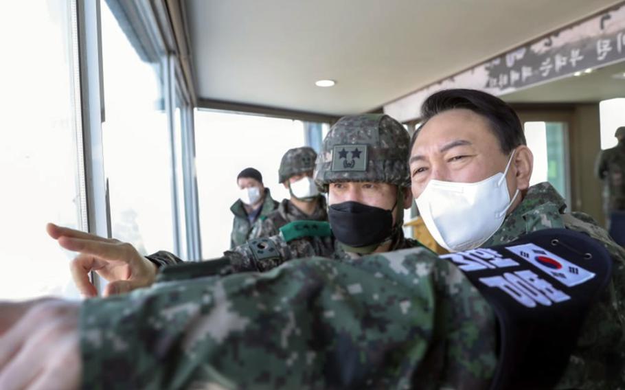 Yoon Seok-youl, right, who will take office as South Korea's 20th president on May 10, 2022, visits the Demilitarized Zone, Dec. 20, 2021. 