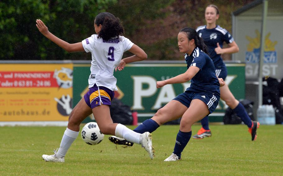 Black Forest Academy’s Ester Lee shoots on goal against Bahrain’s Jade Courts in a Division II game won by BFA 6-0, at the DODEA-Europe soccer finals at Reichenbach-Steegen, Germany, May 21, 2024. 