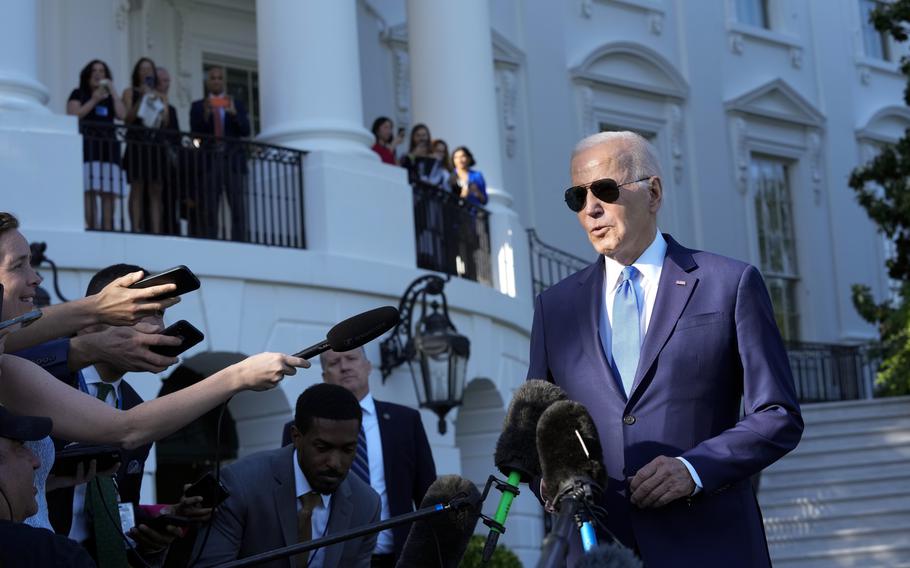 President Joe Biden talks with reporters on the South Lawn of the White House in Washington, Friday, May 26, 2023, as he heads to Camp David for the weekend. 