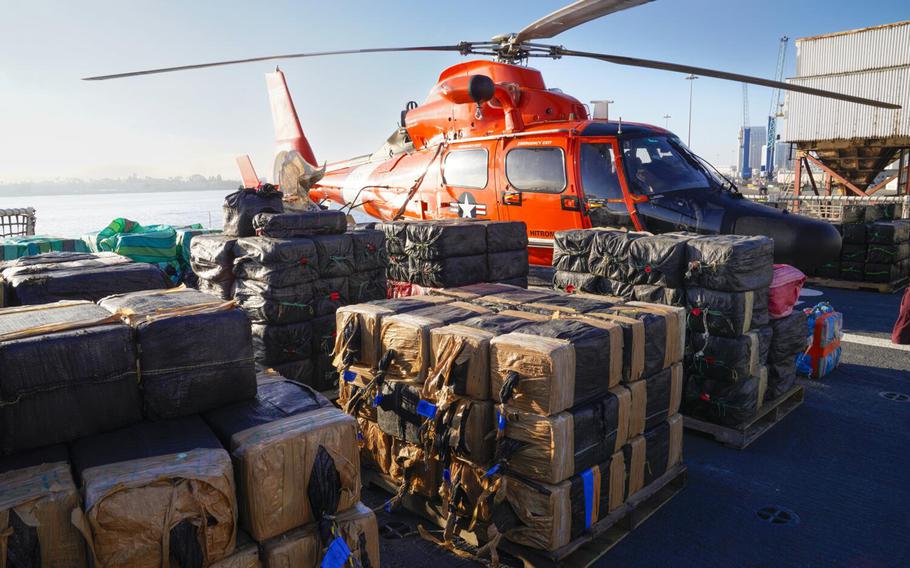 The U.S. Coast Guard prepares to offload about 18,219 pounds of cocaine off the Coast Guard Cutter Waesche in San Diego on Dec. 6, 2023. The seized drugs have an estimated street value of $239 million.