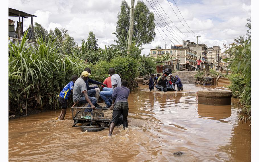 Residents cross floodwater in the Githurai district of Nairobi.